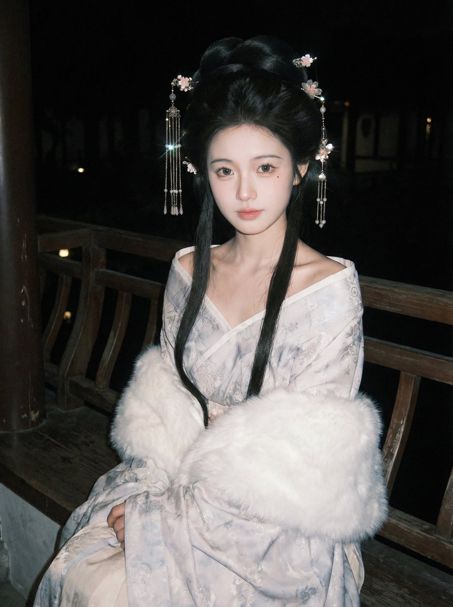 Ancient-style wide-sleeved robe in a garden night scene photograph